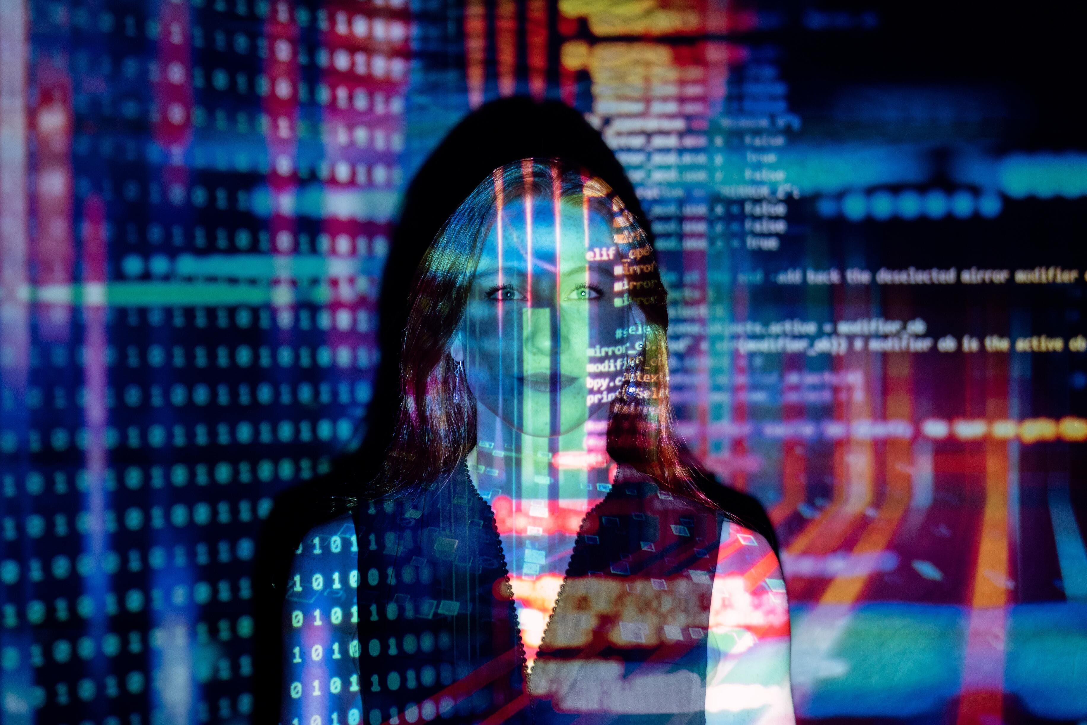A business woman standing in a projected space and trying to make sense of the technology